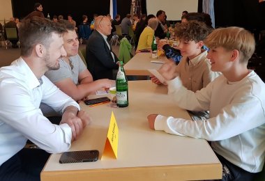 Speed debating round at a table